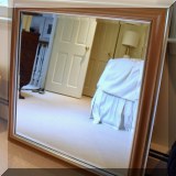 D02. Silver framed mirror with beveled glass. 38” x 38” 